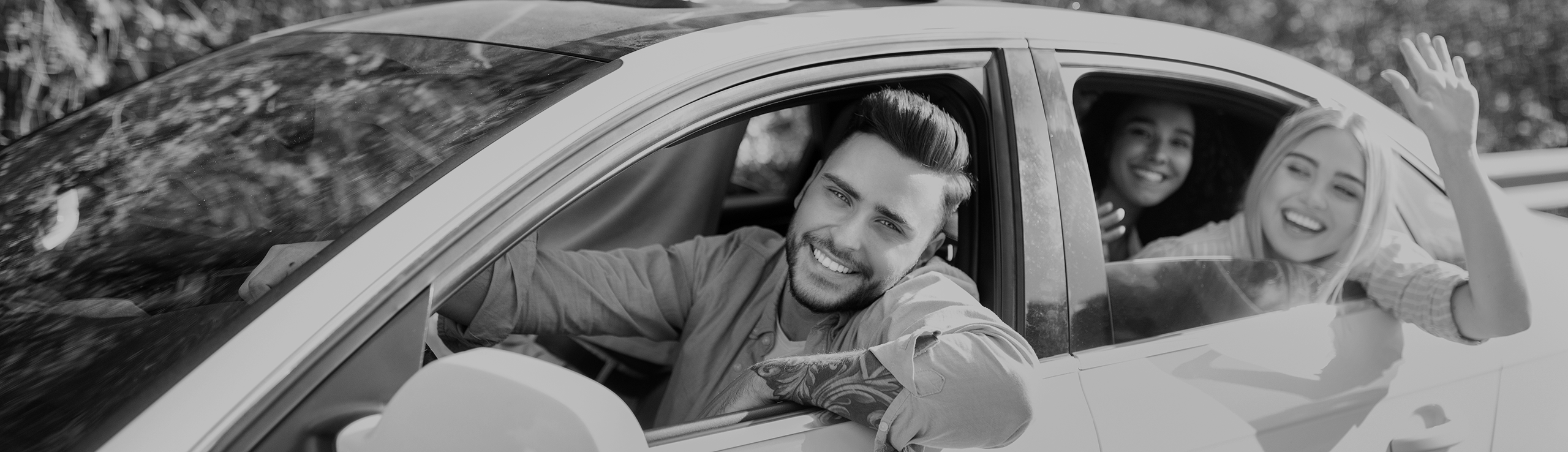 cheerful-young-diverse-friends-riding-their-car-l-2025-03-18-18-44-26-utc